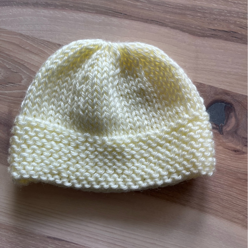 Knit yellow baby cap. Newborn.